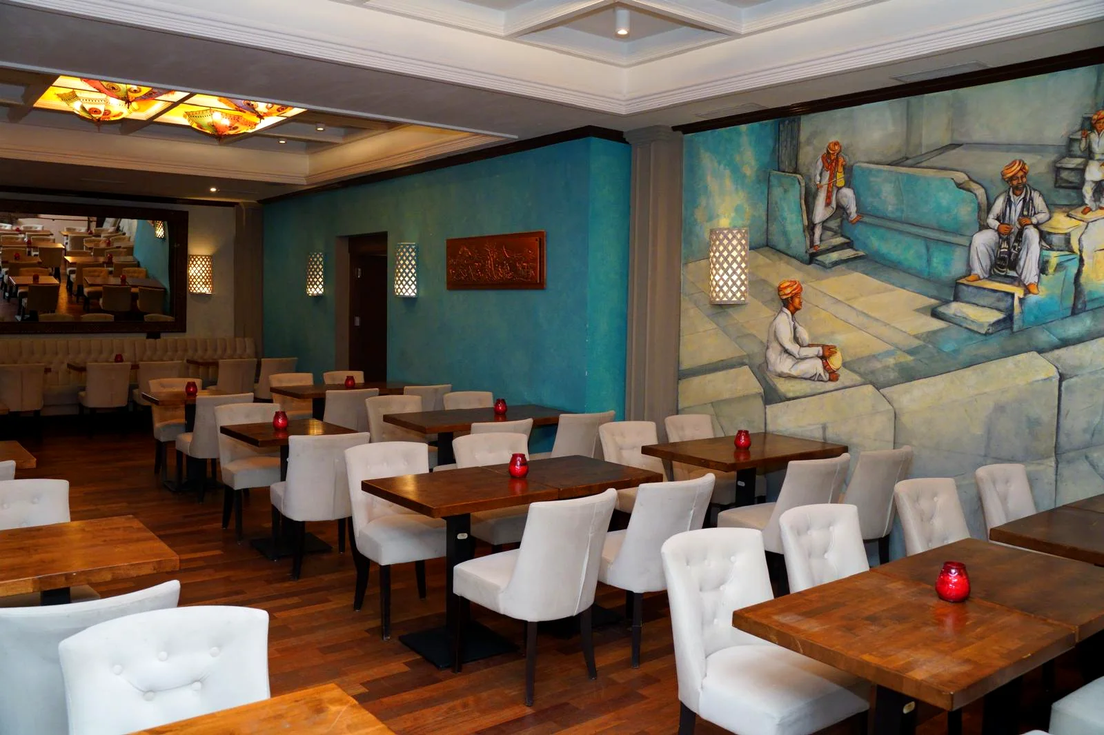 Dining room with Indian mural at Swadesh Restaurant